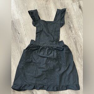 Women cooking black apron